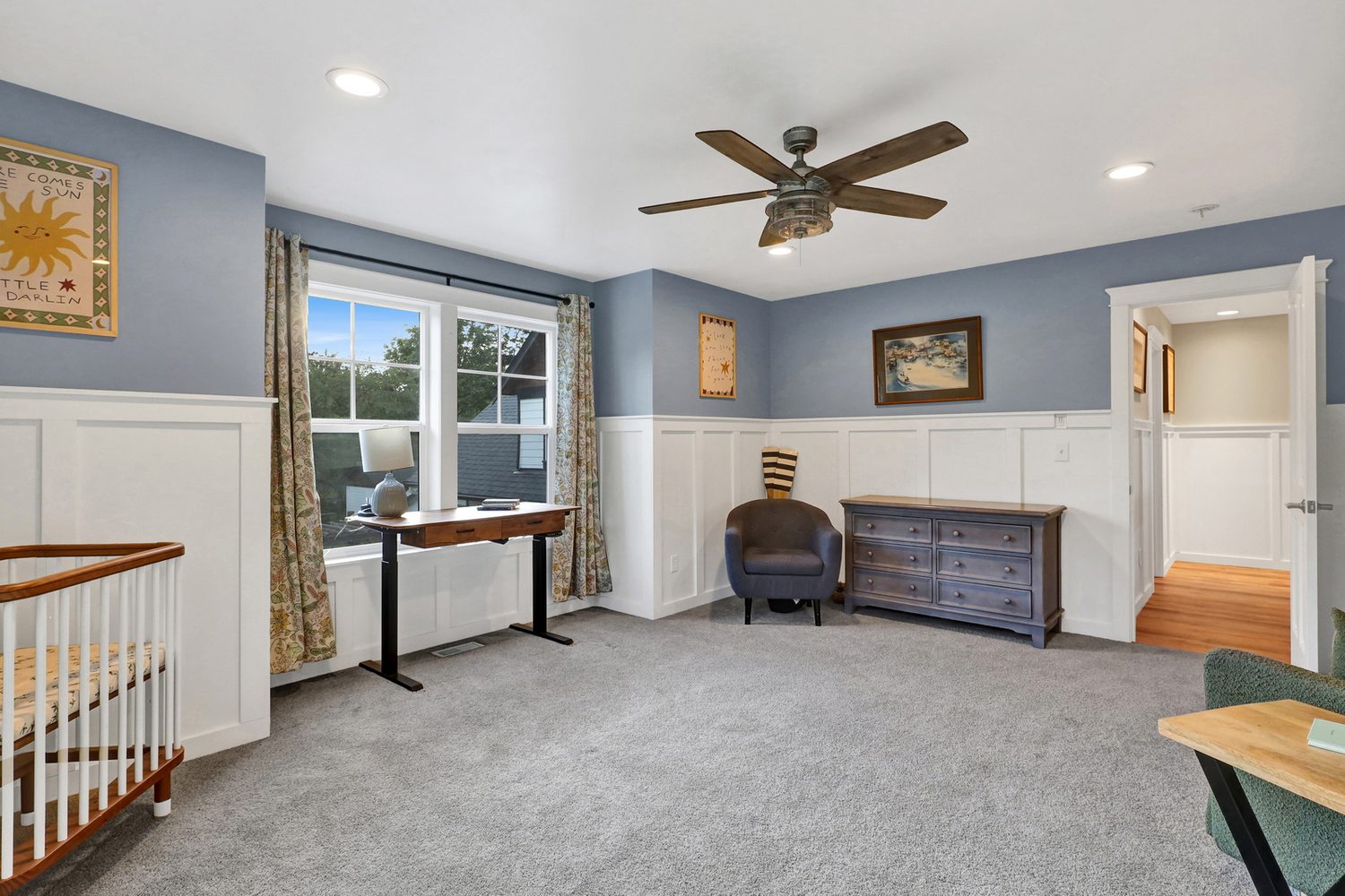 Blue upstairs bedroom with wainscoting at Applegrove