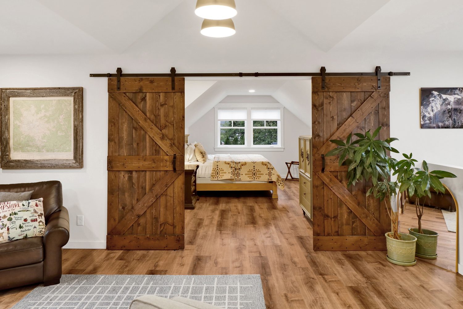 Barn doors leading to a bedroom in the guest quarters