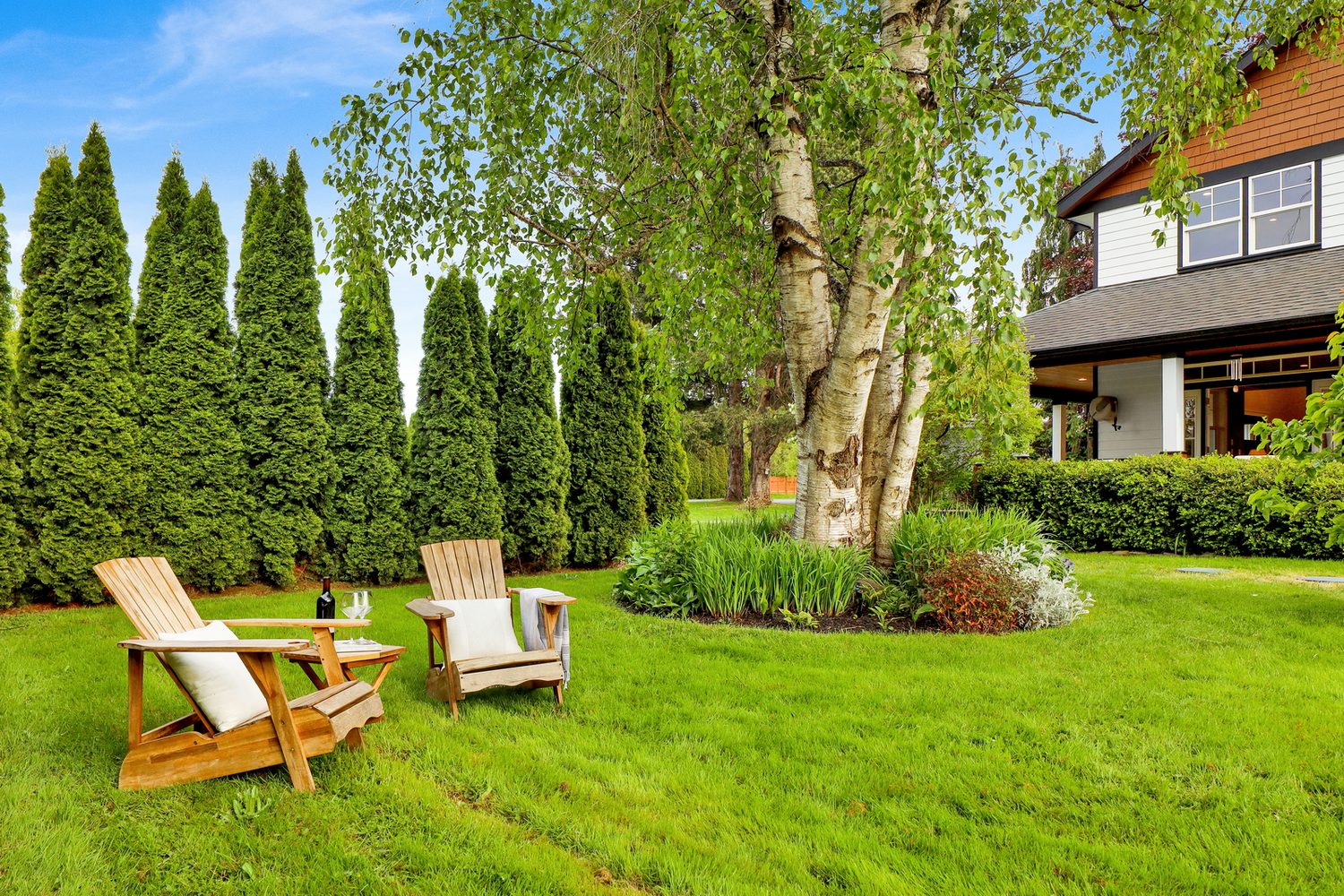 Lawn chairs under mature trees at Applegrove