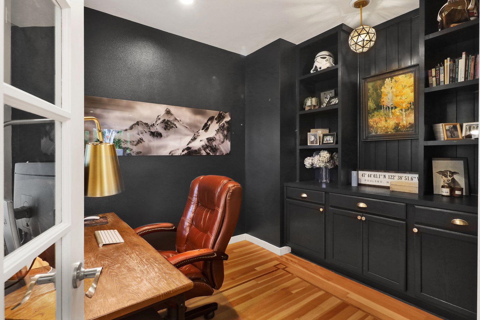 Green office with built-in cabinetry